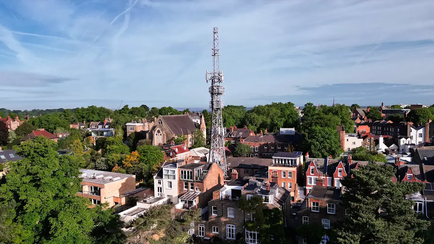 VodafoneThree Network pylon in a town